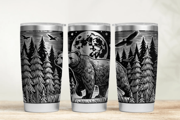 Three tumblers with black and white nature-themed designs on a wooden surface.