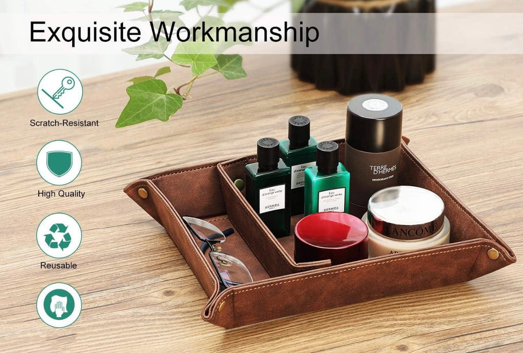 Brown leather tray with various items on a wooden surface, featuring text 'Exquisite Workmanship' and icons.