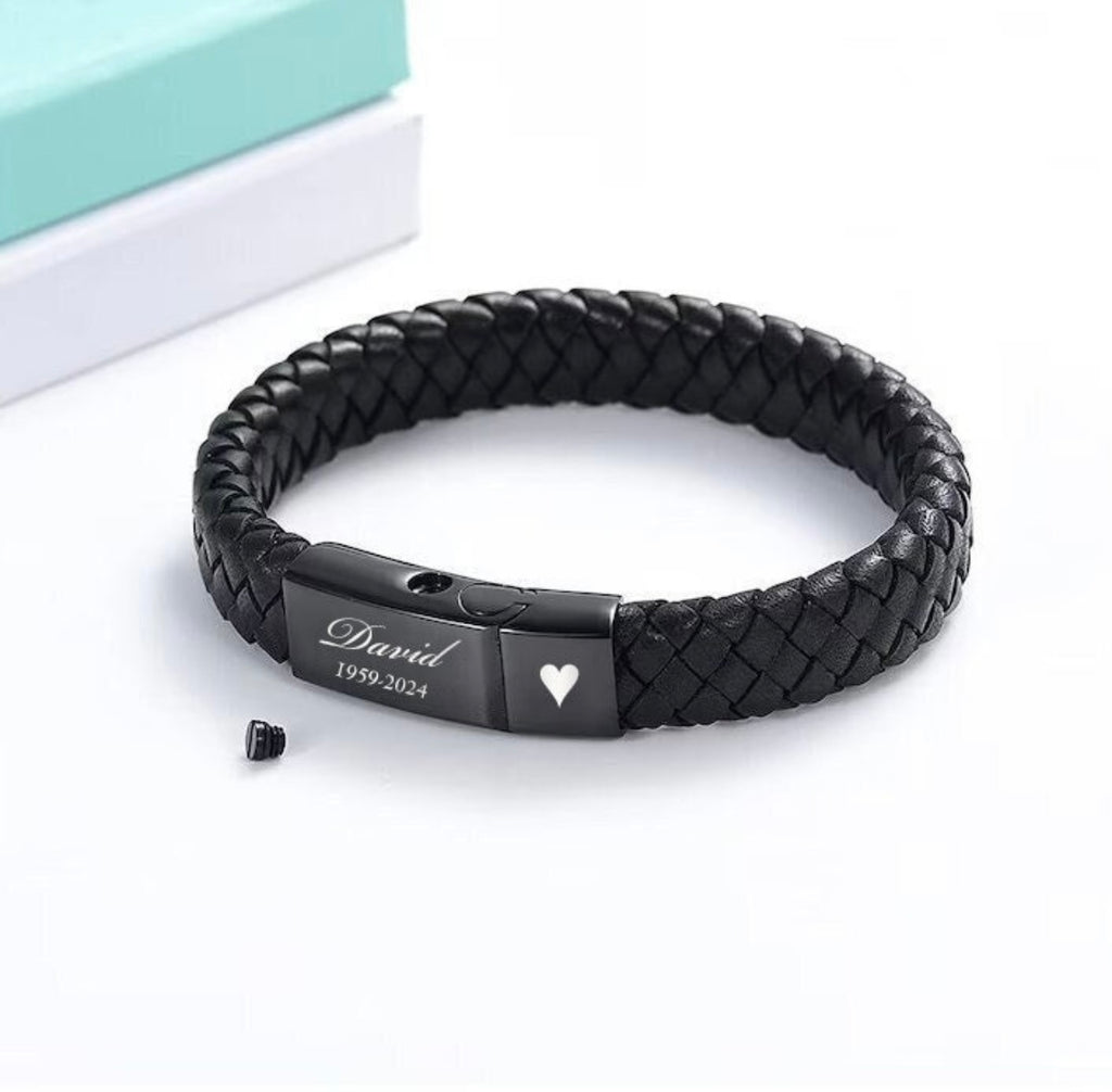 Black braided leather bracelet with engraved name and dates on a white background