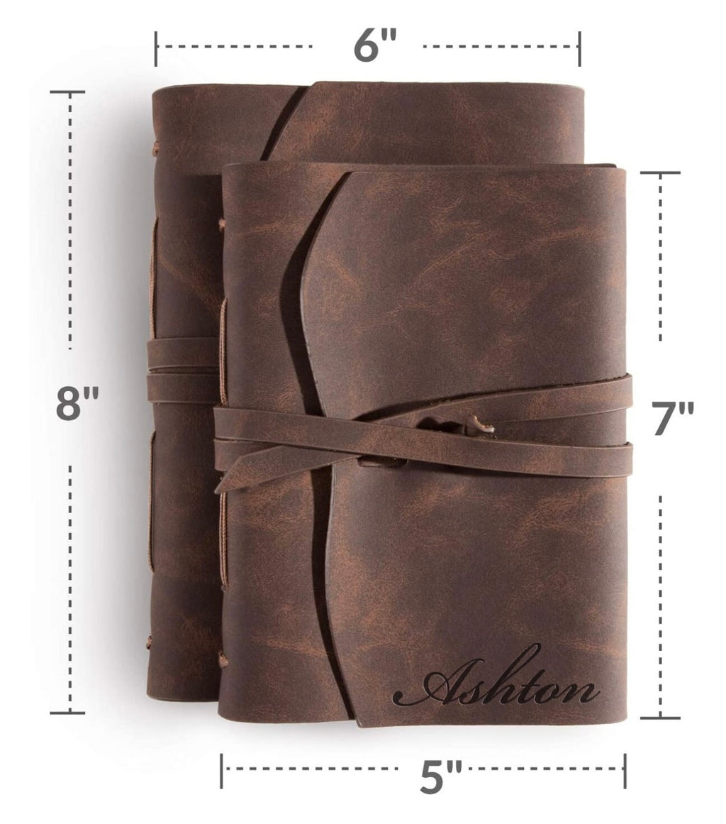 Two leather-bound journals with dimensions labeled on a white background
