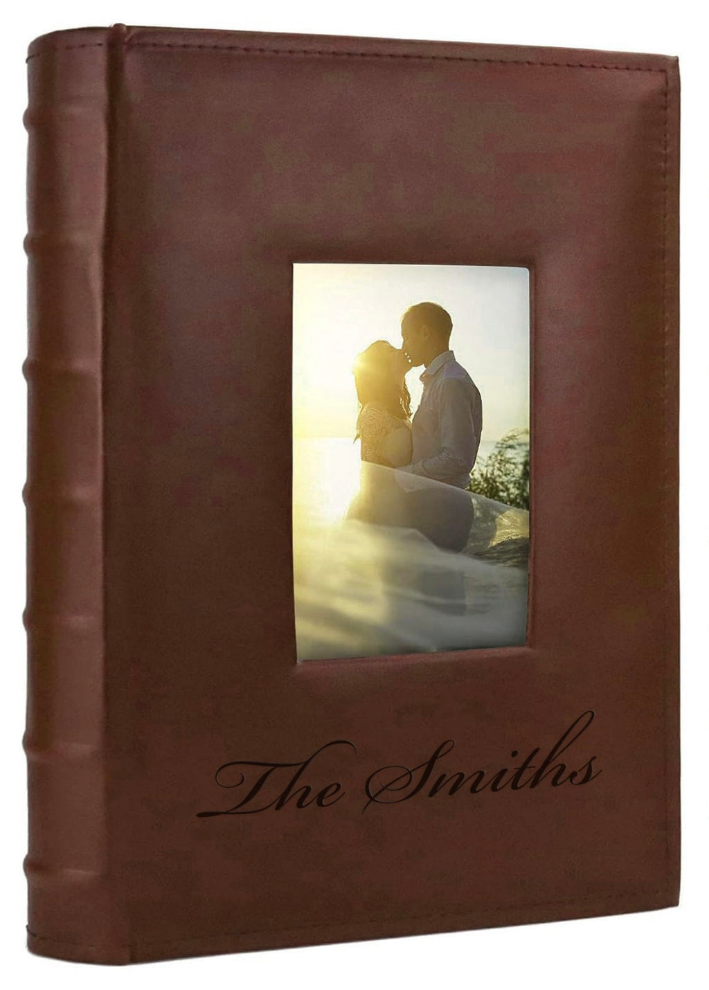 Brown leather photo album with engraving and a picture of a couple on the cover.
