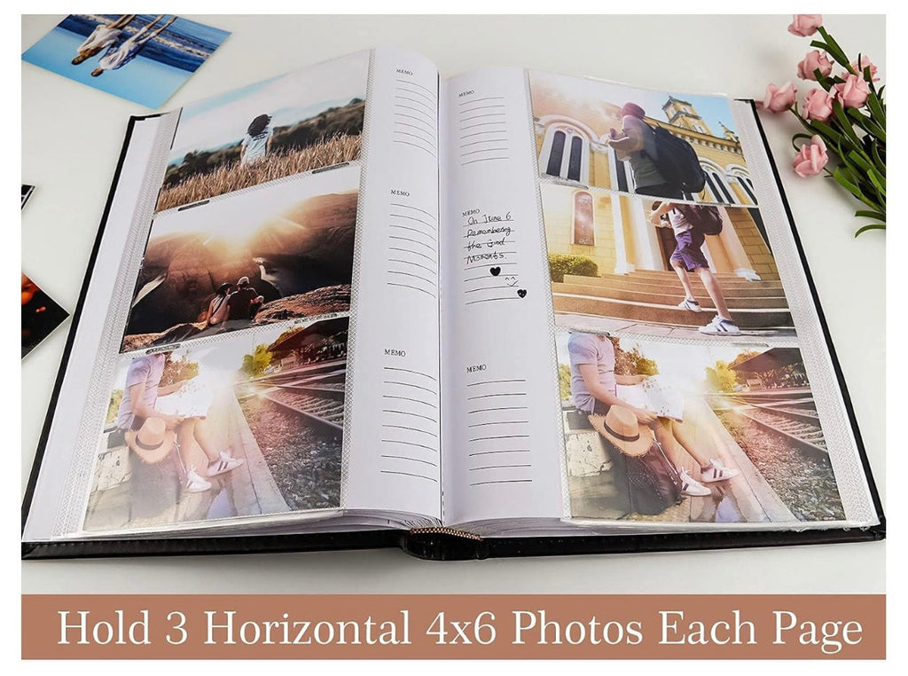 Open photo album with scenic and casual photos on a white surface.
